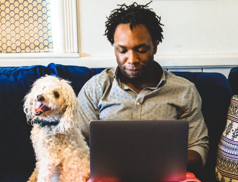 Investor Sitting With Laptop And Dog.jpg